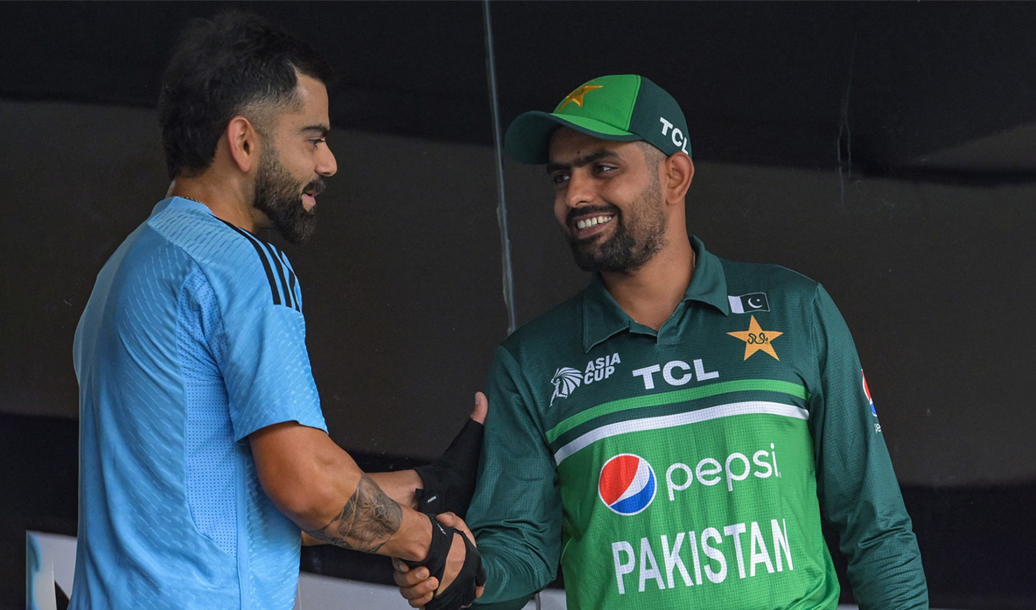India's Virat Kohli, left, shakes hands with Pakistan's captain Babar Azam before the start of the Asia Cup 2023 one-day international (ODI) cricket match at the Pallekele International Cricket Stadium in Kandy on September 2, 2023. (AFP)