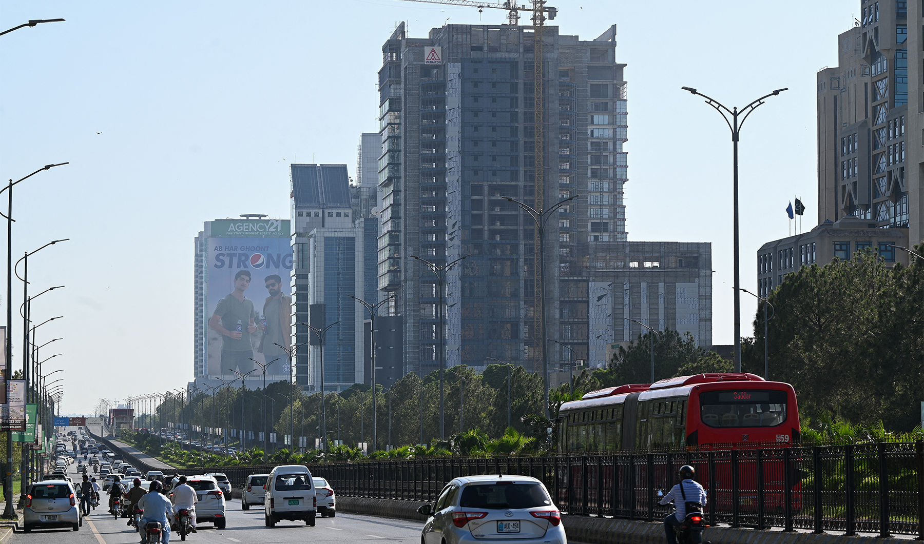 People commute on a road in Islamabad, Pakistan on July 11, 2023. (Photo courtesy: AFP/File)