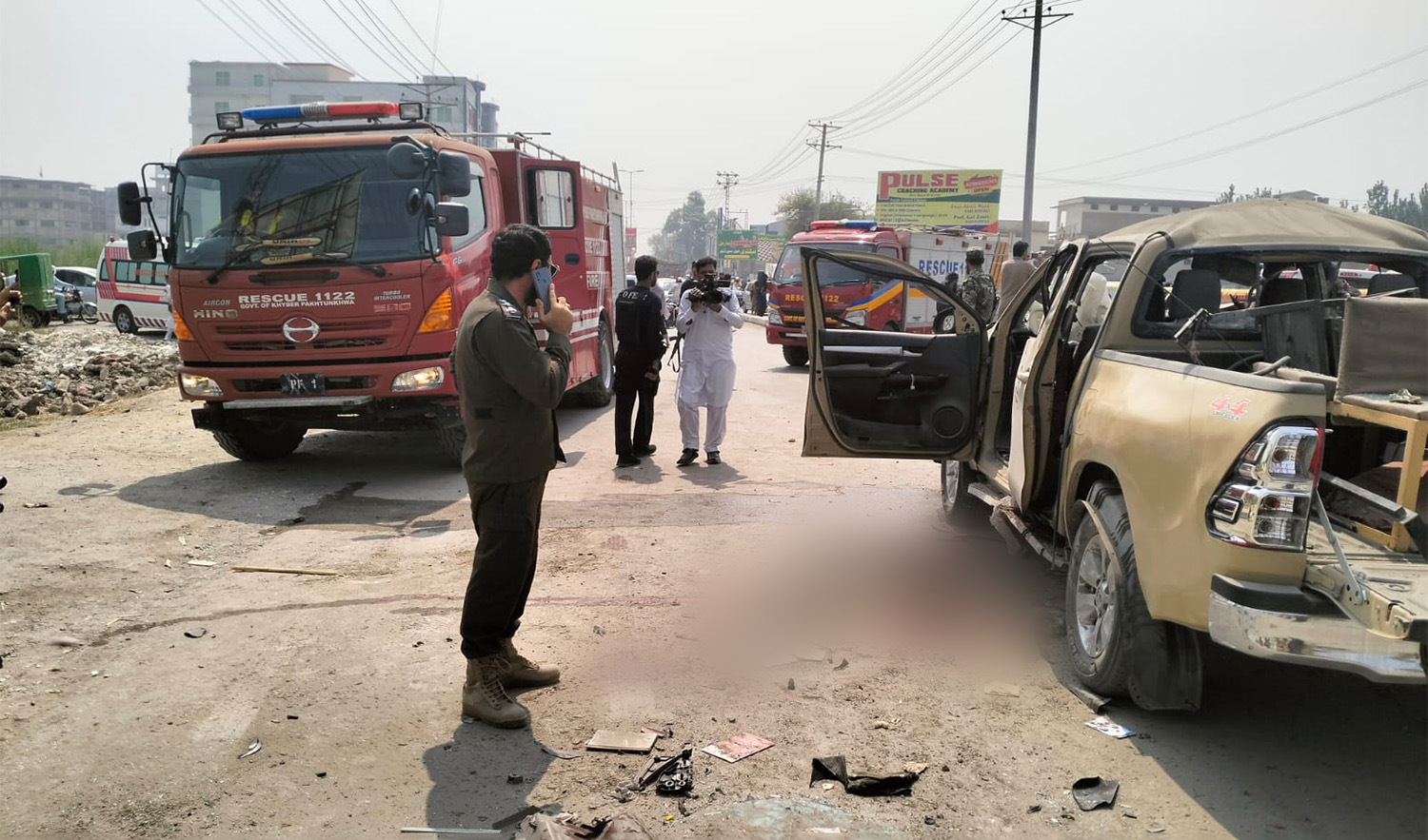 Police and journalists are seen at the site of an explosion involving security forces' vehicle in Peshawar, Pakistan on September 11, 2023. (Photo courtesy: Rescue 1122 Peshawar)