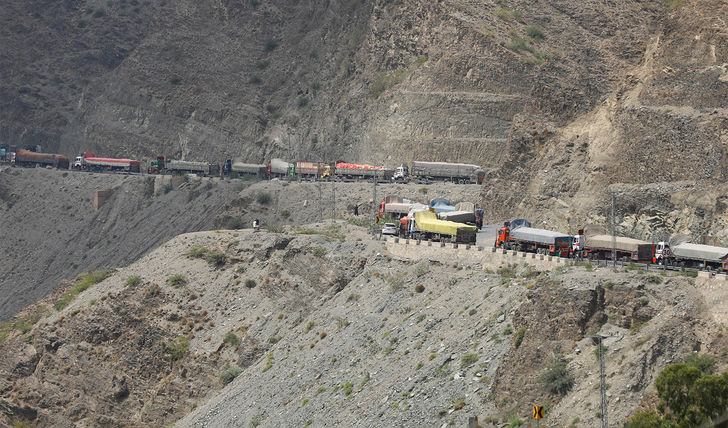 Trucks loaded with supplies to leave for Afghanistan are seen stranded at the Michni checkpost, after the main Pakistan-Afghan border crossing closed after clashes, in Torkham, Pakistan on September 7, 2023. (REUTERS)