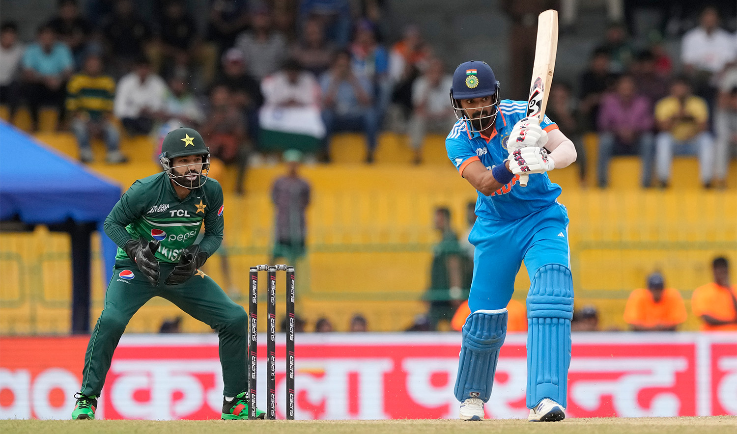 India's KL Rahul plays a shot as Pakistan's Mohammad Rizwan watches during the Asia Cup cricket match between India and Pakistan in Colombo, Sri Lanka on September 11, 2023. (AP)