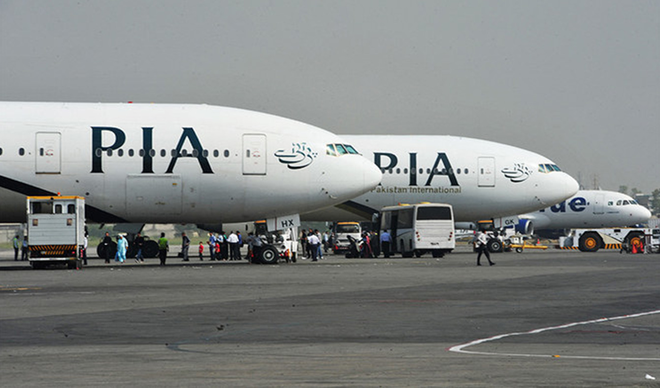 Pakistan International Airline (PIA) planes are positioned on the tarmac at the Benazir Bhutto International Airport in Islamabad on October 10, 2012. (AFP/File)
