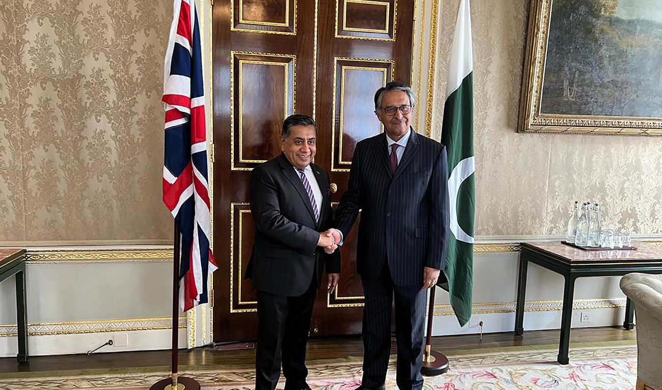 In this handout photograph taken and released by Pakistan High Commission in London, Caretaker Foreign Minister Jalil Abbas Jilani (right) shakes hands with British state minister for foreign, commonwealth, and development office Lord Tariq Ahmad (left) during a meeting in London on September 13, 2023. (Photo courtesy: Pakistan High Commission)