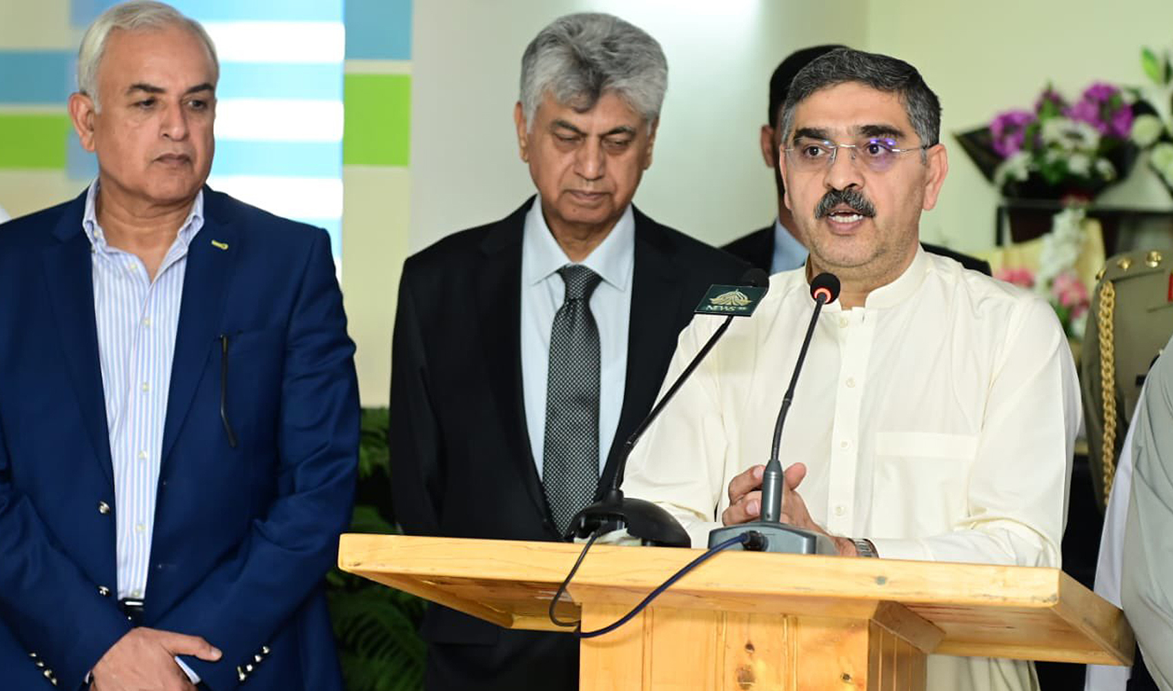 The file photo shows Pakistan's Caretaker Prime Minister Anwaar-ul-Haq Kakar (center) talking to the media after the inauguration of a hospital in Gilgit, Pakistan on September 13, 2023. (Photo courtesy: @GovtofPakistan/Twitter)