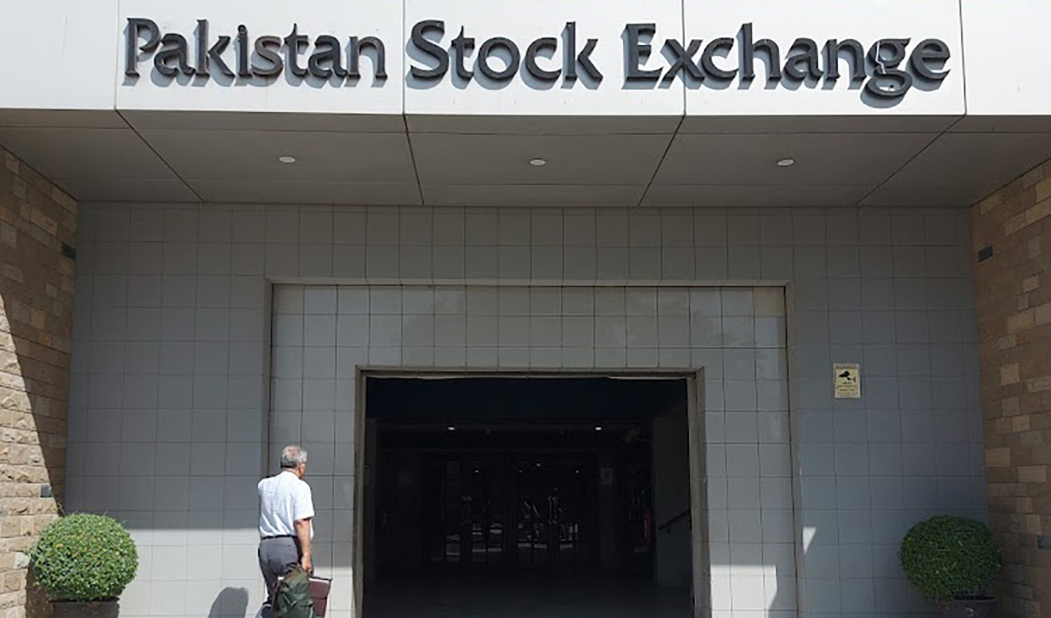 An undated file photo showing a man heading into the Pakistan Stock Exchange premises in Karachi. (Photo courtesy: social media)