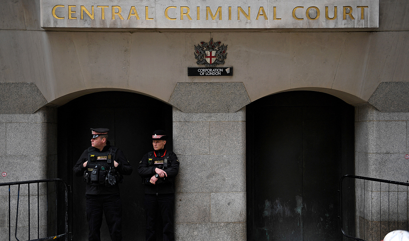 In this file photo, taken on September 30, 2021, Police officers stand on duty outside the Old Bailey, England's Central Criminal Court in London. (AFP/File)