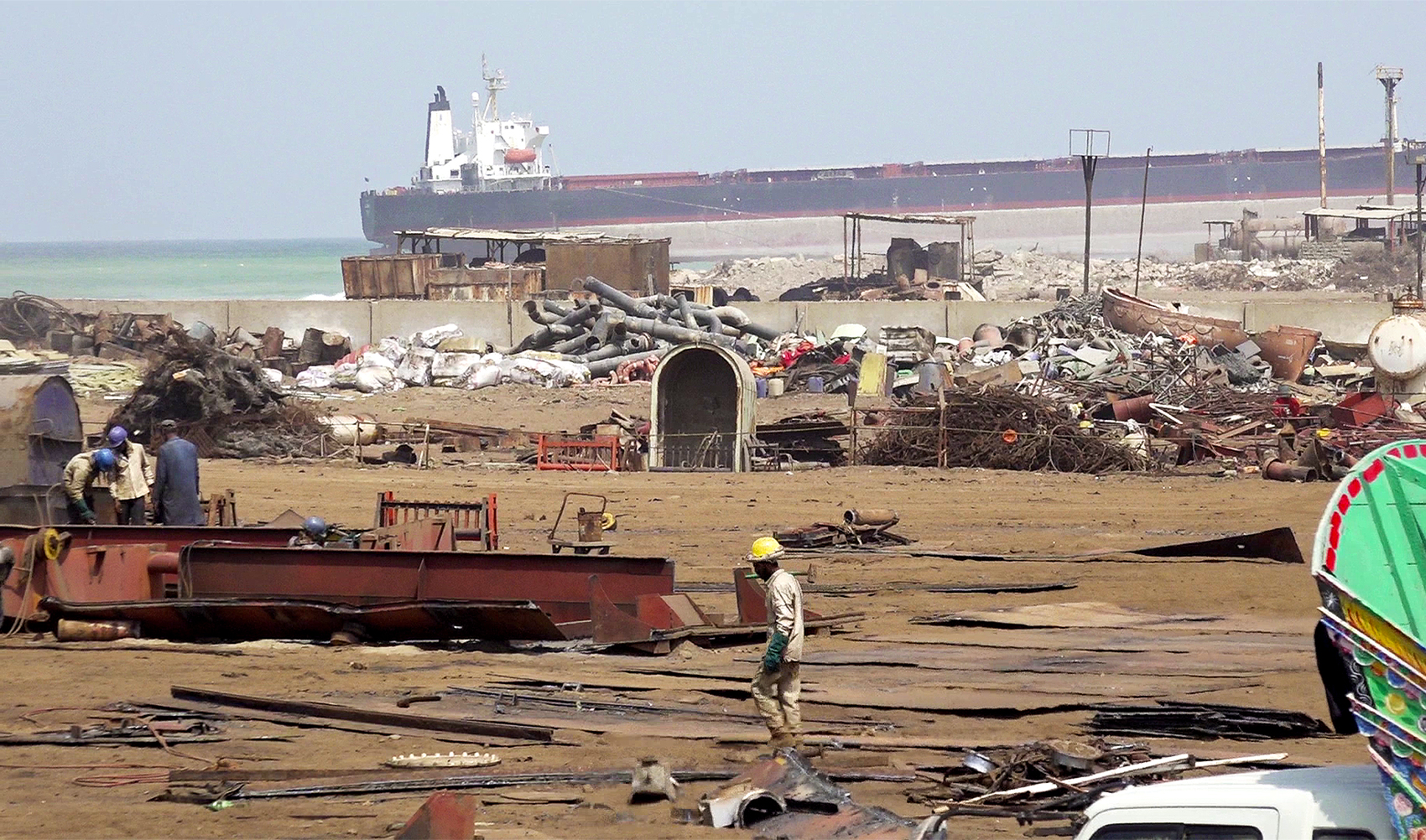 Labourers are working with dismantled parts of a ship at Gadani beach in Pakistan's Balochistan province on September 16, 2023. (AN photo)