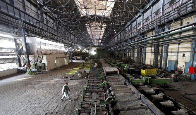In this file photo, a man walks past machines at the hot strip mill department of the Pakistan Steel Mills (PSM) on the outskirts of Karachi on Feb. 8, 2016. (REUTERS/File)