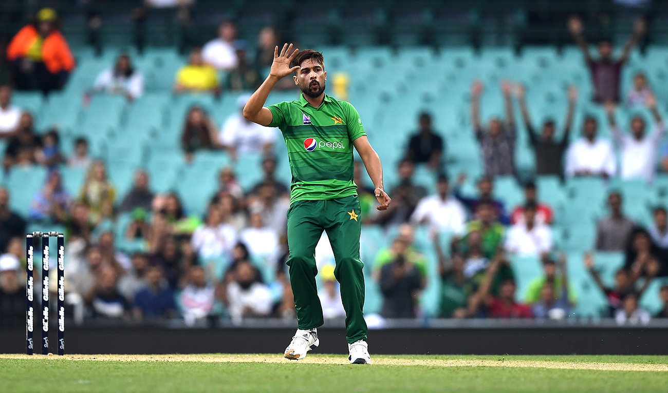 In this file photo, taken on November 3, 2019, Pakistan's paceman Mohammad Amir reacts after he bowls during the Twenty20 match between Australia and Pakistan at the Cricket Cricket Ground in Sydney. (AFP/File)