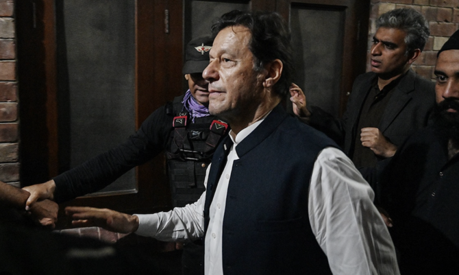 Former Pakistan's Prime Minister Imran Khan (C) leaves after appearing at the high court in Lahore on March 17, 2023. (AFP/File)