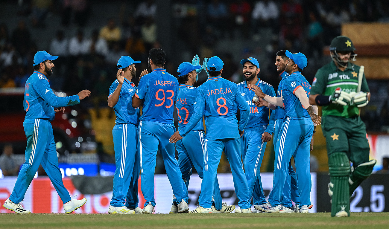 India's Jasprit Bumrah (3L) celebrates with teammates after taking the wicket of Pakistan's Imam-ul-Haq (R) during the Asia Cup 2023 super four one-day international (ODI) cricket match between India and Pakistan at the R. Premadasa Stadium in Colombo on September 11, 2023. (AFP/File)