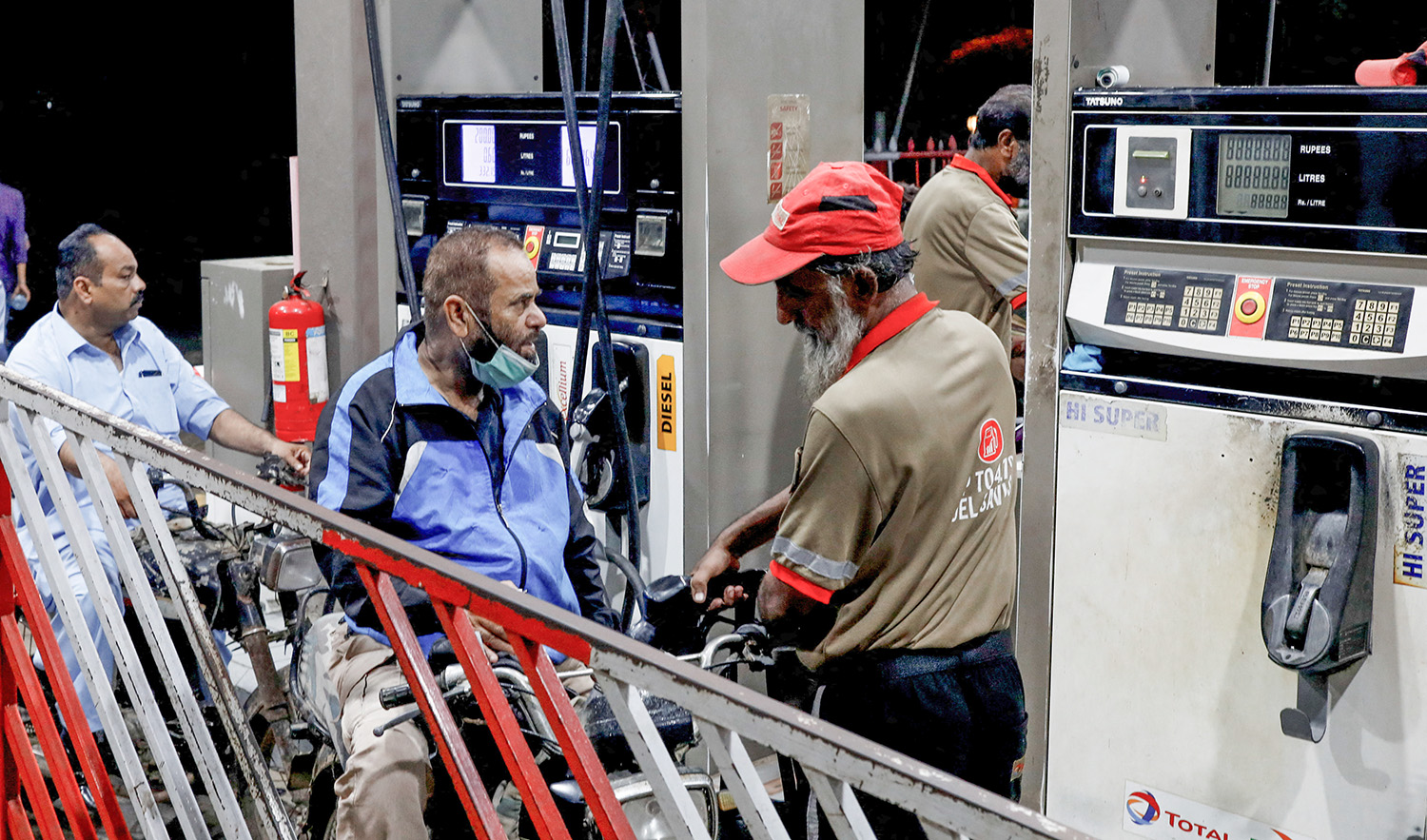 People get fuel at a petrol station after the government announced the increase of petrol and diesel prices, in Karachi, Pakistan on September 16, 2023. (REUTERS)