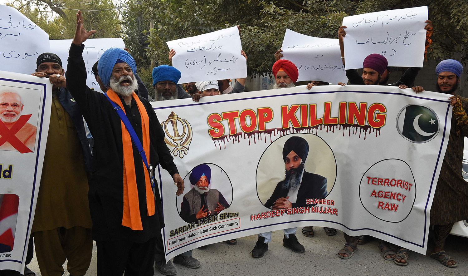 Members of Pakistan's Sikh community shout slogans as they hold banners during a protest in Quetta on September 23, 2023, to condemn the killing of a Sikh separatist Hardeep Singh Nijjar in Canada. (AFP)