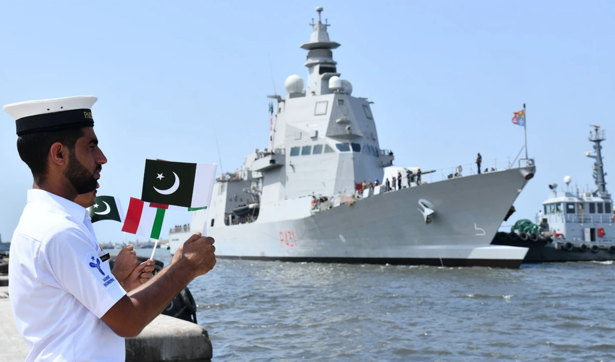 Pakistani navy soldier waves flags as an Italian Navy ship Morosini visits southern port city of Karachi in Karachi, Pakistan, on September 5, 2023. (Photo courtesy: Pakistan Navy)