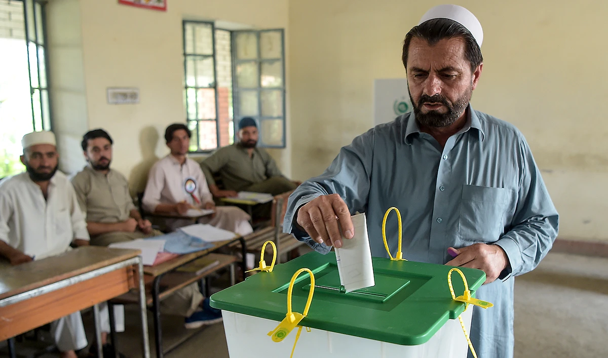 In this file photo, taken on July 20, 2019, a tribesman ballot casts his vote in a polling station for provincial elections in Jamrud, a town of the Khyber Pakhtunkhwa province. (AFP/File)