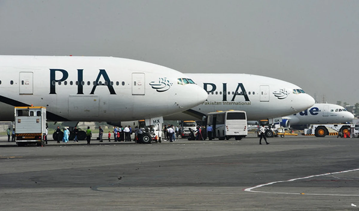 Pakistan International Airline (PIA) planes are positioned on the tarmac at the Benazir Bhutto International Airport in Islamabad on October 10, 2012. (AFP/File)