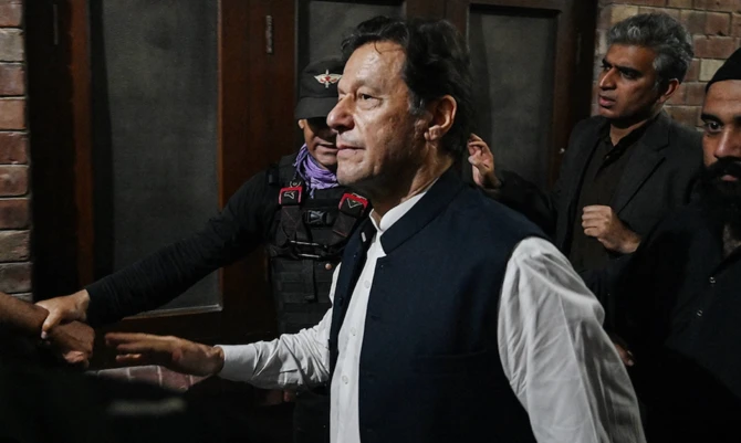 Former Pakistan's Prime Minister Imran Khan (C) leaves after appearing at the high court in Lahore on March 17, 2023. (AFP/File)