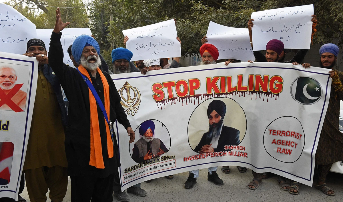 Members of Pakistan's Sikh community shout slogans as they hold banners during a protest in Quetta on September 23, 2023, to condemn the killing of a Sikh separatist Hardeep Singh Nijjar in Canada. (AFP)