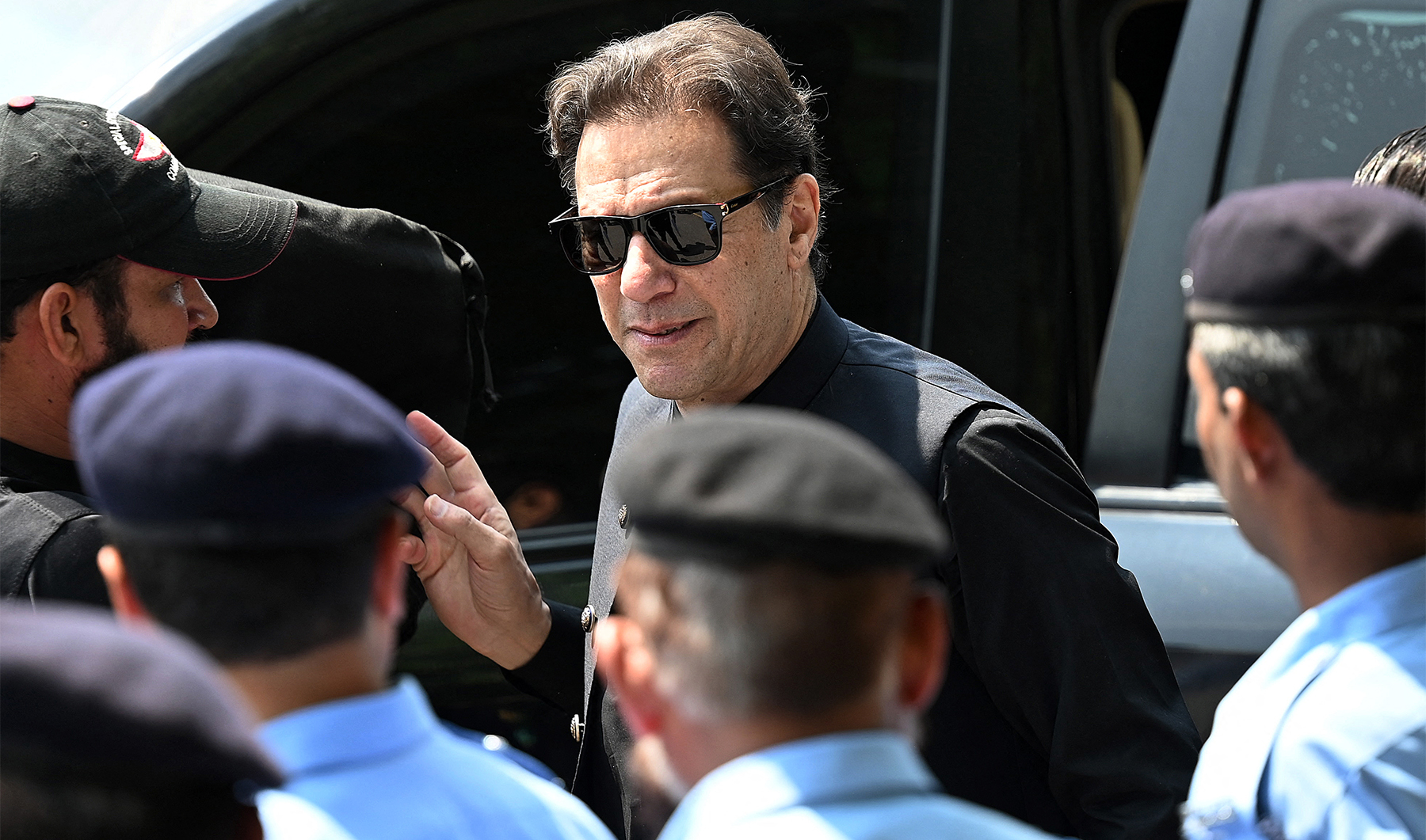 Pakistan’s former Prime Minister Imran Khan (C) arrives to appear in the Supreme Court in Islamabad on July 24, 2023. (AFP/File)