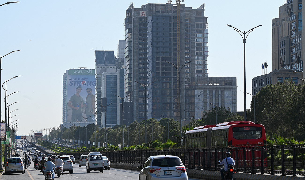 People commute on a road in Islamabad on July 11, 2023. (AFP/File)