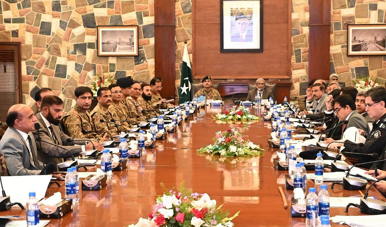 In this handout photo, taken and released by Pakistan's Inter Service Public Relation (ISPR), Pakistan Army Chief General Syed Asim Munir (center, left) along with Caretaker Chief Minister Sindh Justice (Retired) Maqbool Baqar (center, right) heads meeting of the Provincial Apex Committee in Karachi on October 6, 2023. (Photo courtesy: ISPR)