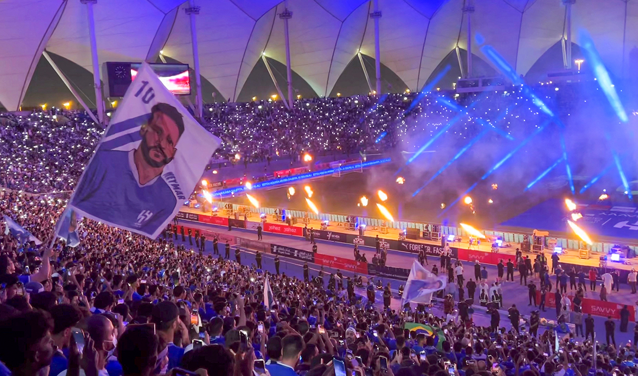 A fan waves a flag bearing the image of Brazil's forward Neymar during his unveling at at Al-Hilal in Riyadh's King Fahd International Stadium on August 19, 2023. (AFP/File)