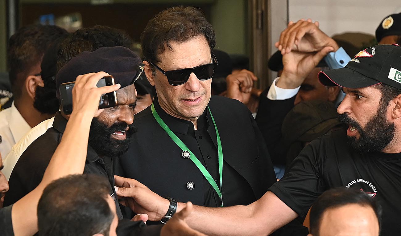Pakistan’s former Prime Minister Imran Khan (C) leaves after appearing in the Supreme Court in Islamabad on July 24, 2023. (AFP/File)