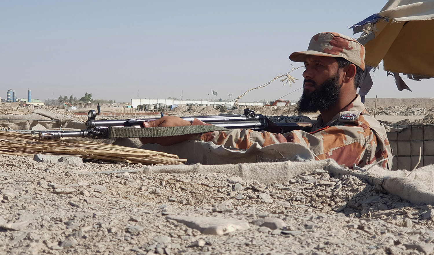 In this representational photo, Pakistani paramilitary soldier stands guard near the Pakistan-Afghanistan border crossing point in Chaman District in Balochistan, Pakistan on August 18, 2021. (AFP/File)