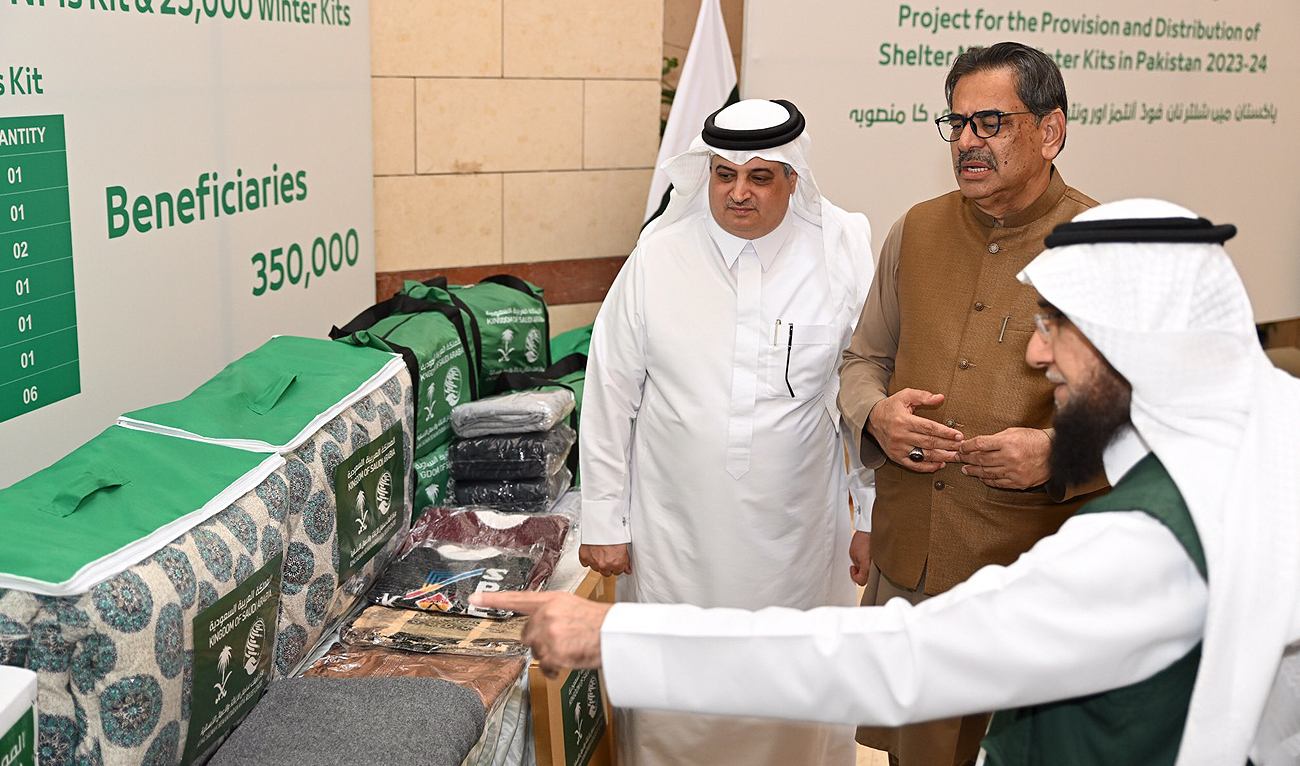 Saudi Ambassador to Pakistan Nawaf bin Saeed Al-Maliki, Pakistan's Minister of Religious Affairs Aneeq Ahmad and Director of KSrelief branch in Pakistan Dr. Khalid Al-Othmani gesture during the inauguration ceremony of KSrelief's winter project at the Saudi embassy in Islamabad on October 6, 2023. (Photo courtesy: X/@KSAembassyPK)