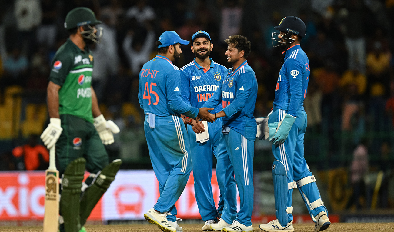 India's Kuldeep Yadav (2R) celebrates with teammates after taking the wicket of Pakistan's Fakhar Zaman (L) during the Asia Cup 2023 super four one-day international (ODI) cricket match between India and Pakistan at the R. Premadasa Stadium in Colombo on September 11, 2023. (AFP/File)