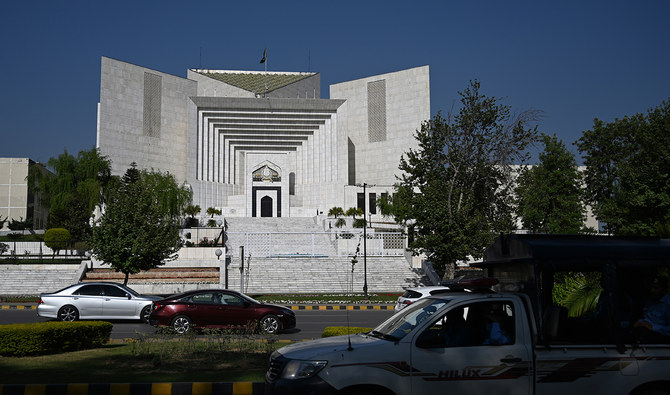 Motorists drive past Pakistan's Supreme Court in Islamabad on April 5, 2022. (AFP/File)