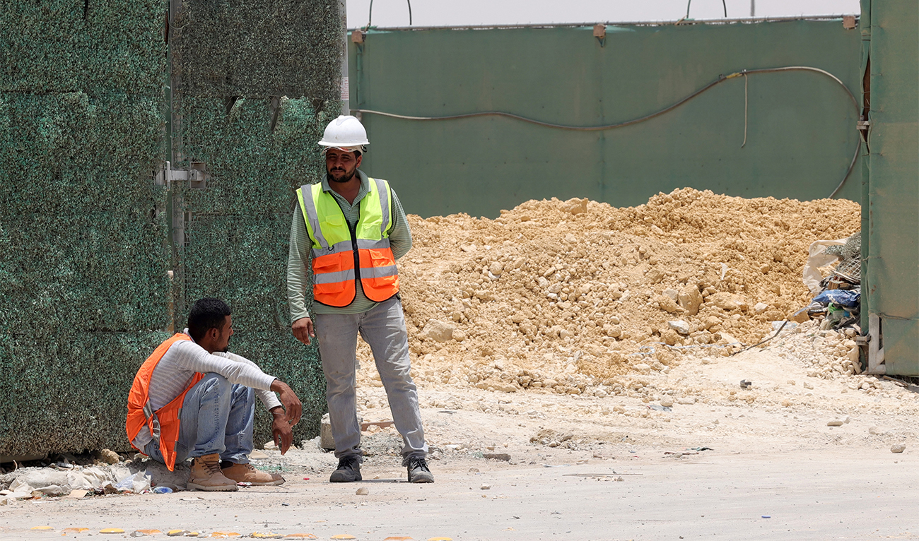 Foreign labourers take a break during their workday at a construction site amid scorching heat in the Saudi capital Riyadh, on June 16, 2022. (AFP/File)