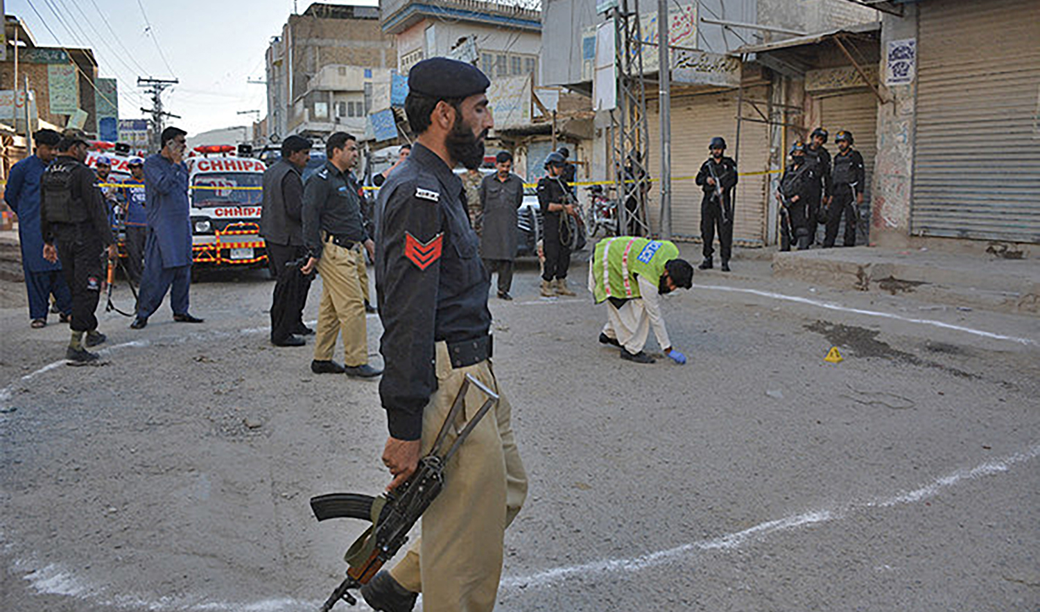 This representational file photo shows Pakistani investigators gather at the shooting site in Quetta, Pakistan, on May 27, 2018. (AFP/File)
