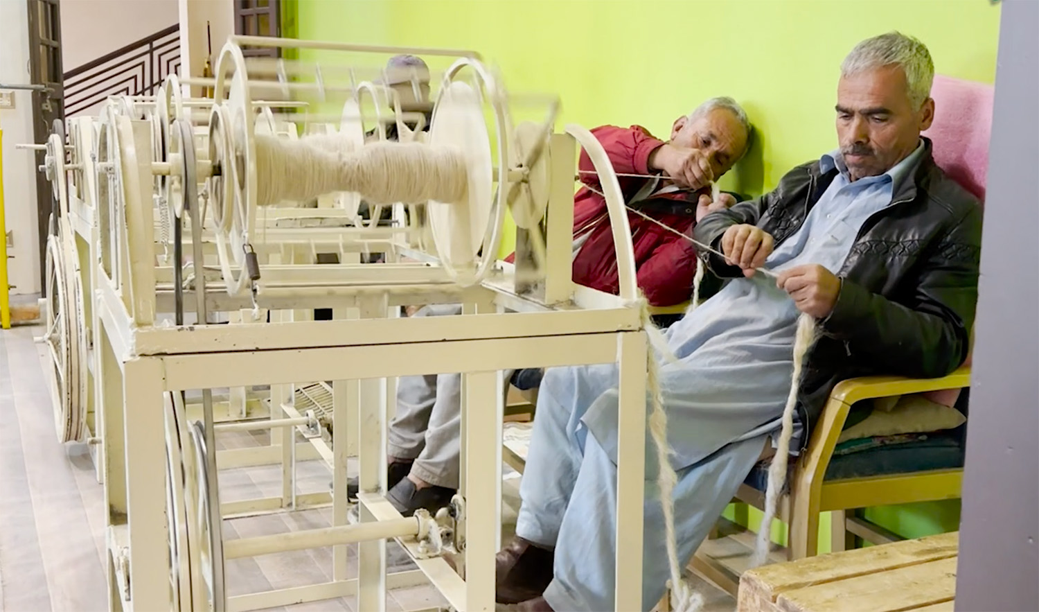 Workers operate a spinning wheel at Karakorum Area Development Organization (KADO) in Hunza Valley, Pakistan on October 10, 2023. (AN photo)