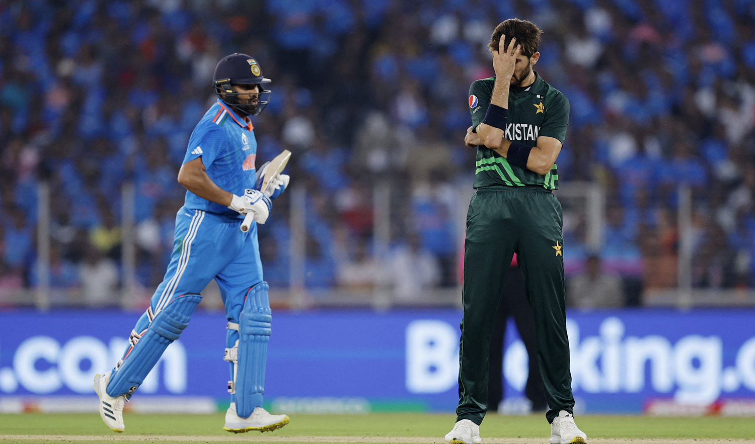 Pakistan's Shaheen Afridi reacts as India's Rohit Sharma runs between the wickets during an ICC Cricket World Cup 2023 match at the Narendra Modi Stadium in Ahmedabad, India on October 14, 2023. (REUTERS)
