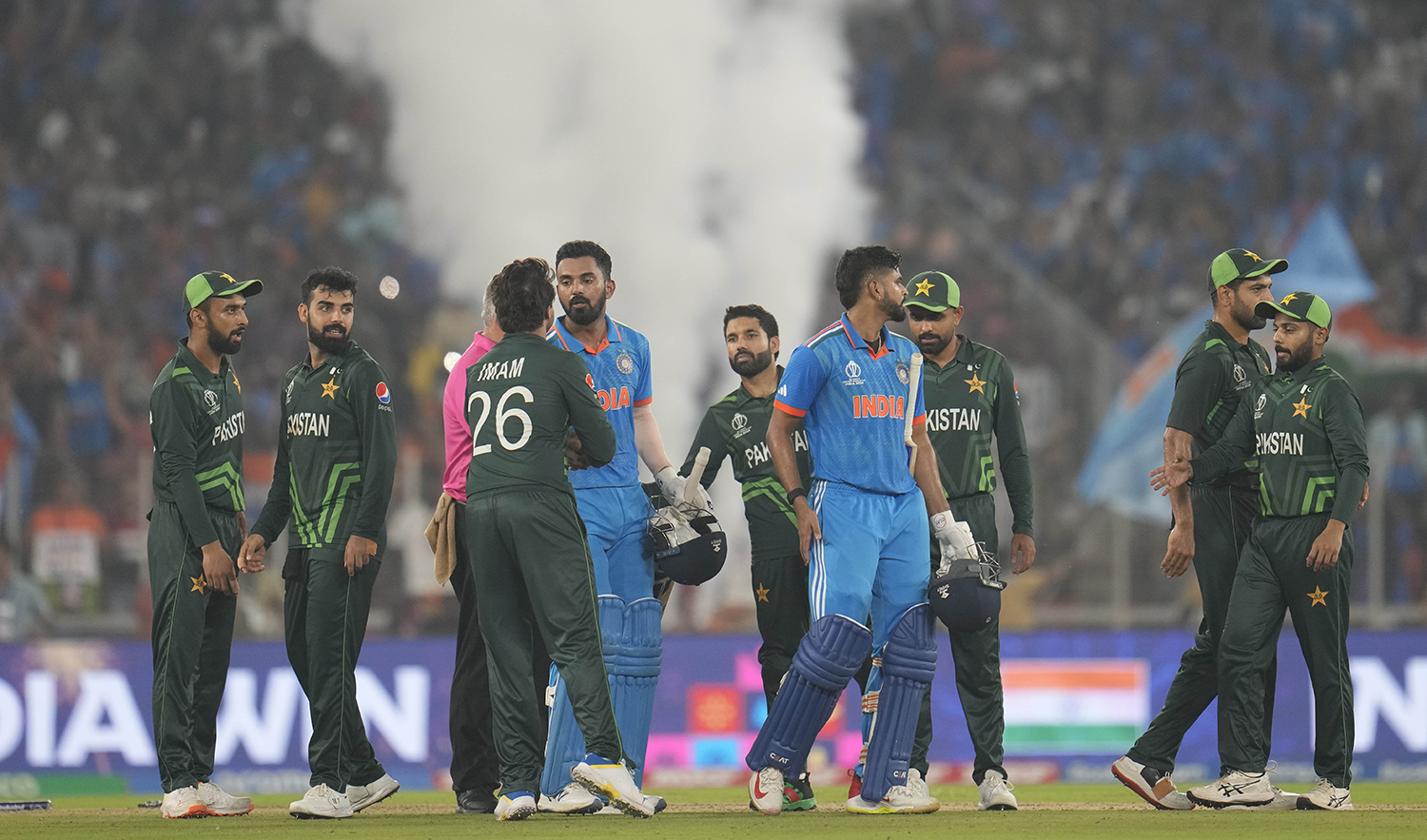 Pakistani players congratulate India's Shreyas Iyer and KL Rahul after India won by 7 wickets during the ICC Men's Cricket World Cup in Ahmedabad, India, on October 14, 2023. (AP)