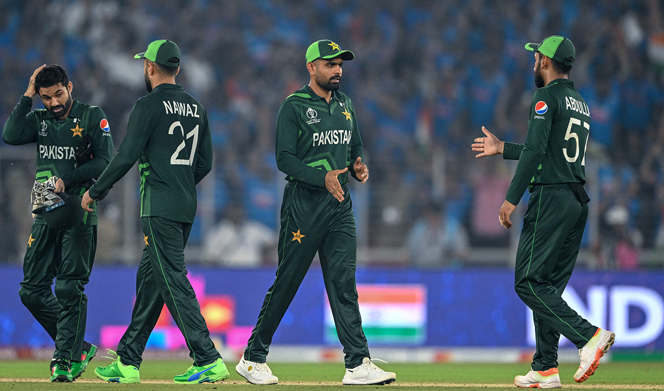 Pakistan's captain Babar Azam (C) shakes hands with his teammates at the end of the 2023 ICC Men's Cricket World Cup one-day international (ODI) match between India and Pakistan at the Narendra Modi Stadium in Ahmedabad on October 14, 2023. (AFP/File)