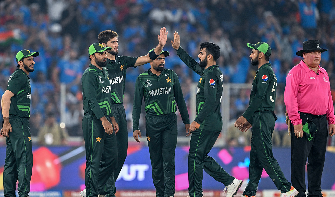 Pakistan's Shaheen Shah Afridi (3L) celebrates with teammates after taking the wicket of India's captain Rohit Sharma during the 2023 ICC Men's Cricket World Cup one-day international (ODI) match between India and Pakistan at the Narendra Modi Stadium in Ahmedabad on October 14, 2023. (AFP/File)