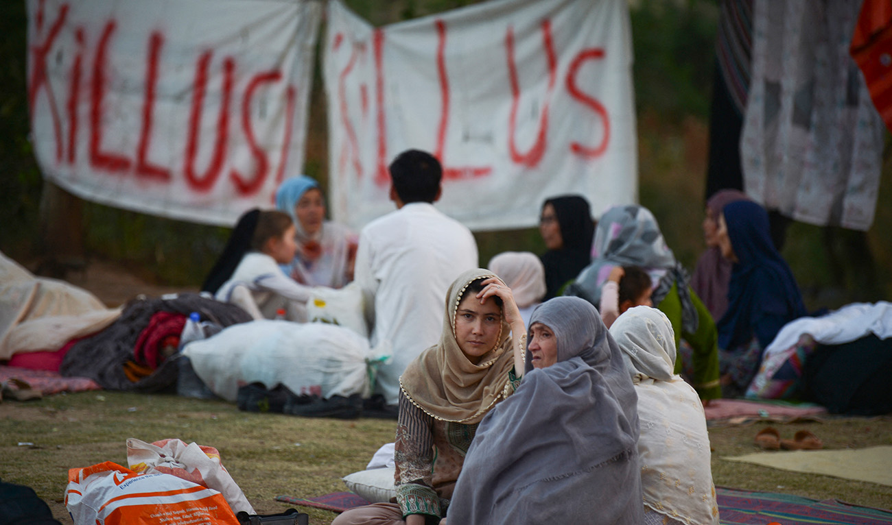 Afghan refugees seeking asylum abroad gather at an open field in protest to demand help from the United Nations High Commissioner for Refugees (UNHCR), in Islamabad on May 7, 2022. (AFP/File)