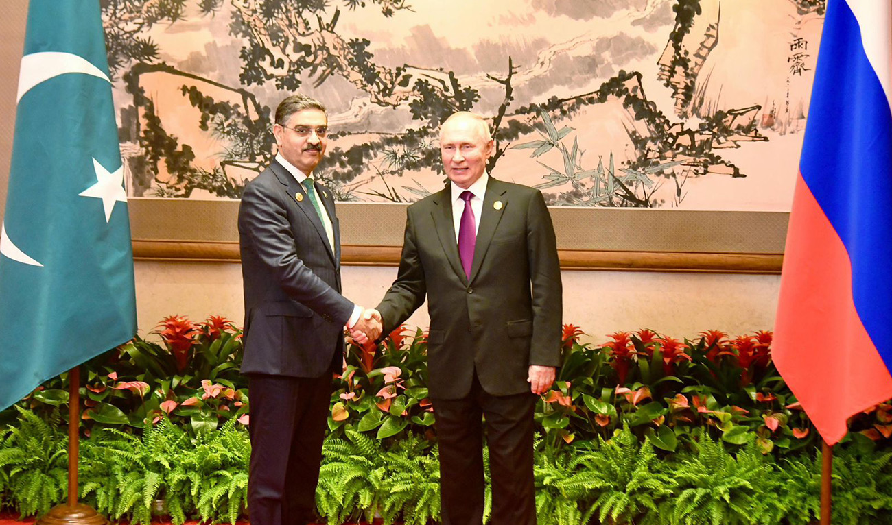 Pakistan's Caretaker Prime Minister Anwaar-ul-Haq Kakar (left) shakes hands with the President of Russia, Vladimir Putin, at the 3rd Belt and Road Forum in Beijing, China on October 17, 2023. (Photo courtesy: @PakPMO/X)