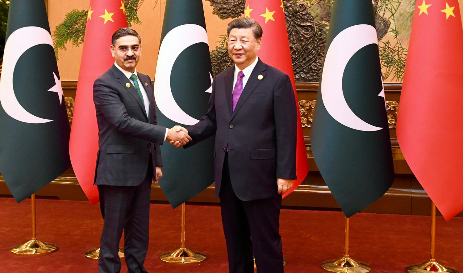Pakistan's caretaker prime minister Anwaar-ul-Haq Kakar, left, meets Chinese President Xi Jinping on the sidelines of the Belt and China forum on October 19, 2023. (Photo courtesy: @anwaar_kakar/X)