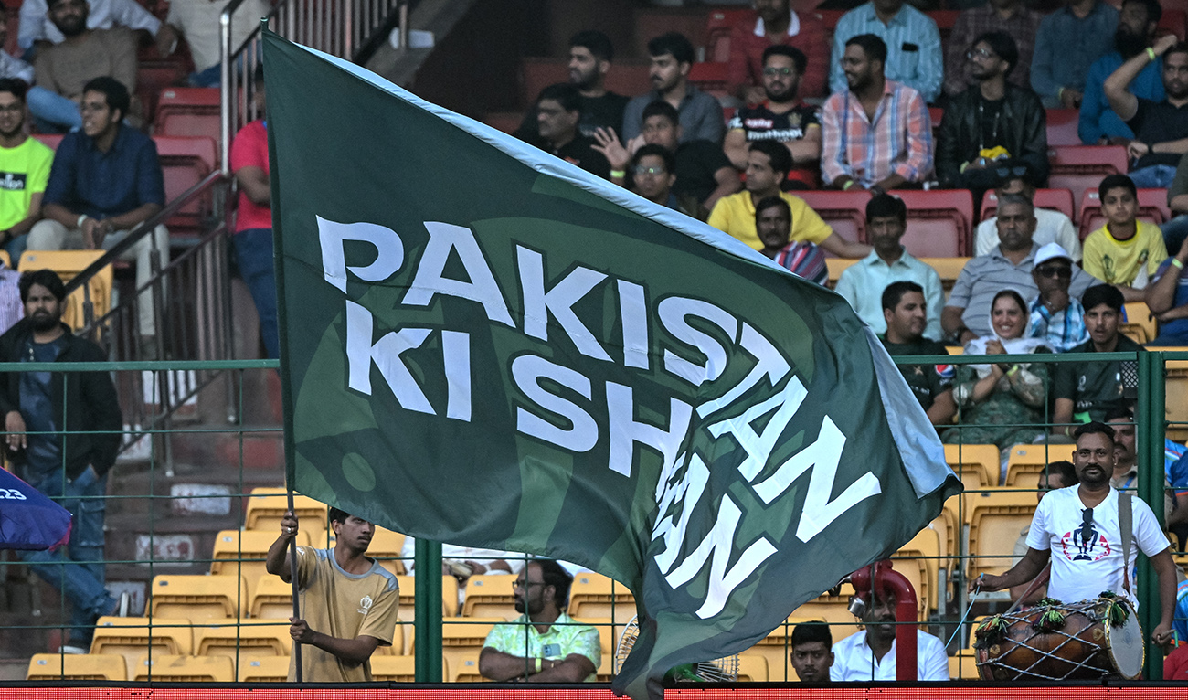 A fan waves a flag as he cheers for Pakistan's team during the 2023 ICC Men's Cricket World Cup one-day international (ODI) match between Australia and Pakistan at the M. Chinnaswamy Stadium in Bengaluru on October 20, 2023. (AFP/File)