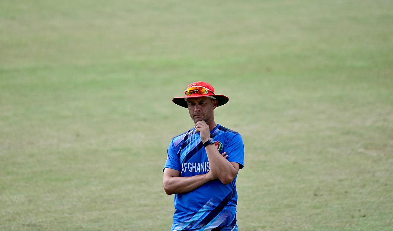 Afghanistan’s head coach Jonathan Trott watches during a practice session at the Zahur Ahmed Chowdhury Stadium in Chittagong on July 6, 2023, ahead of their second one-day international (ODI) cricket match against Bangladesh. (AFP/File)