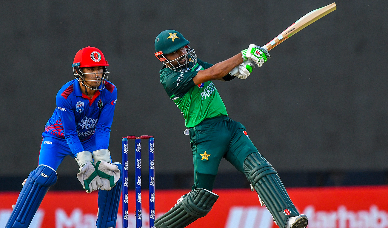 Pakistan's Babar Azam plays a shot as Afghanistan's Rahmanullah Gurbaz (L) looks on during the third and final one-day international (ODI) cricket match between Pakistan and Afghanistan at the R. Premadasa Stadium in Colombo on August 26, 2023. (AFP/File)
