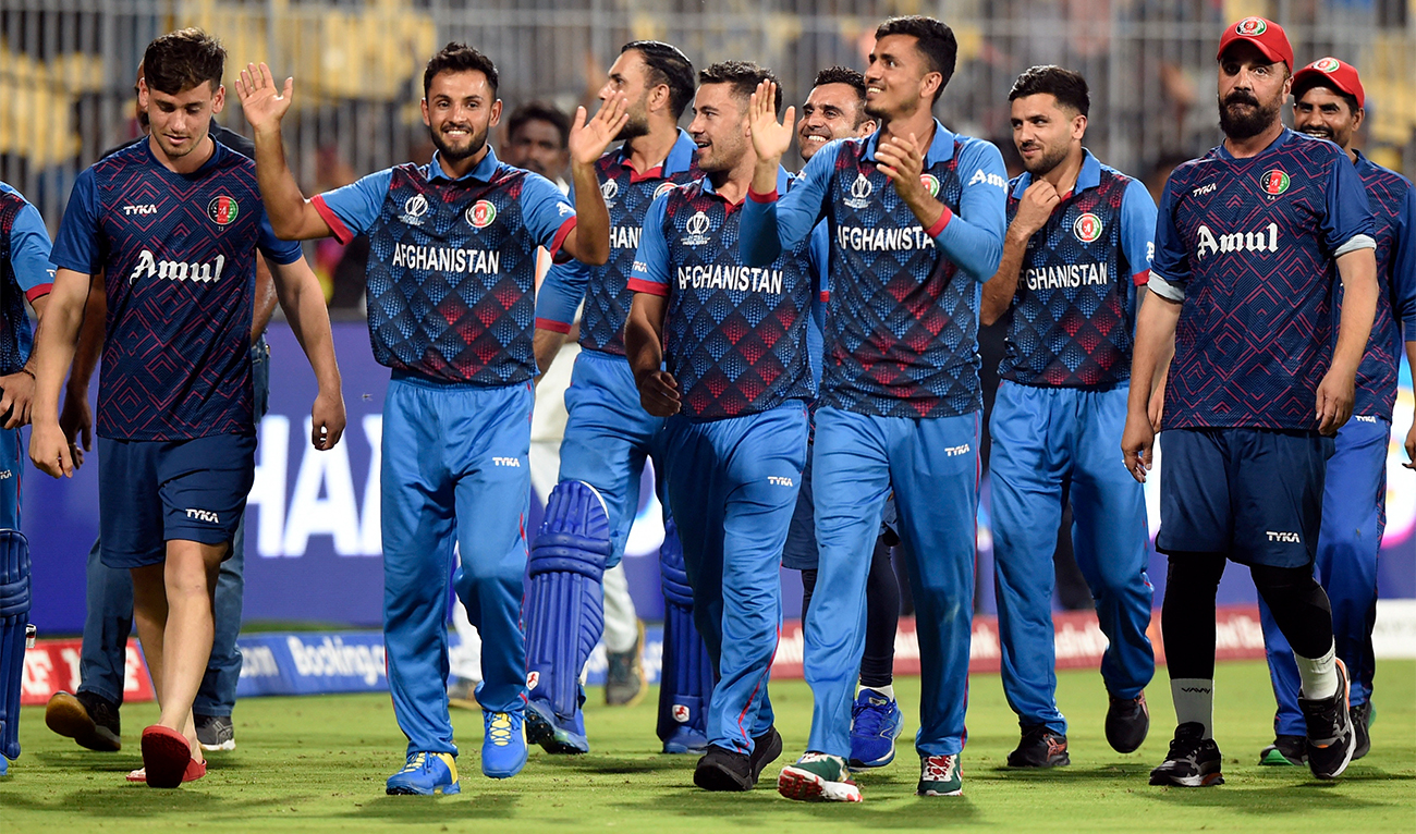 Afghanistan players and staff celebrate after winning the match against Pakistan at MA Chidambaram Stadium in Chennai, India, on October 23, 2023. (REUTERS)