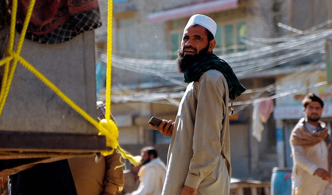 An Afghan refugee stands next to his luggage at Landi Kotal bazaar, Pakistan and Afghanistan at Torkham in Khyber, Pakistan on October 19, 2023. (AN Photo)