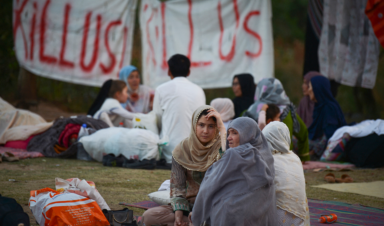 Afghan refugees seeking asylum abroad gather at an open field in protest to demand help from the United Nations High Commissioner for Refugees (UNHCR), in Islamabad on May 7, 2022. (AFP/File)