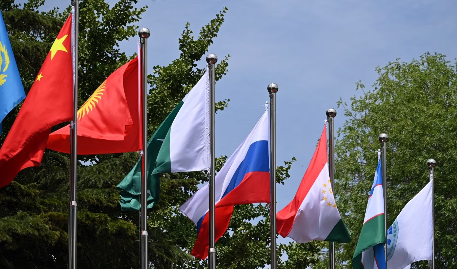 Flags flutter at the headquarters of the Shanghai Cooperation Organization in Beijing on July 4, 2023. (AFP/File)
