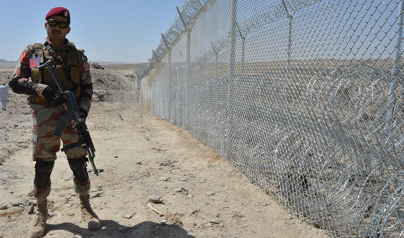 A Pakistani army soldier stands guard along with border fence at the Pak-Afghan border near the Punjpai area of Quetta in Balochistan on May 8, 2018. (AFP/File)
