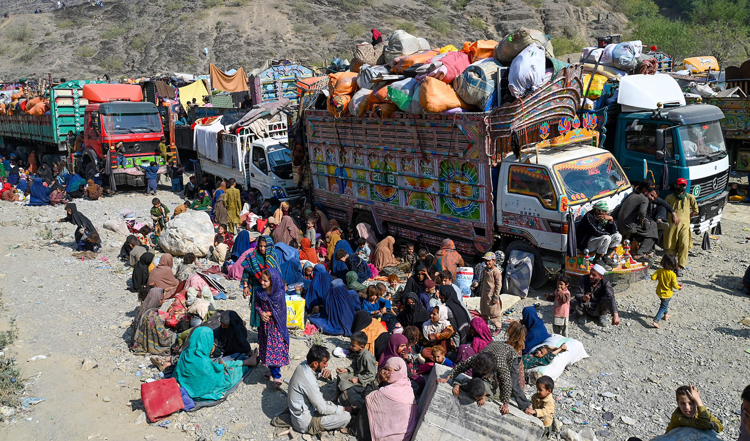 Afghan refugees arrive in trucks from Pakistan at the Afghanistan-Pakistan Torkham border in Nangarhar province on October 30, 2023. (AFP)